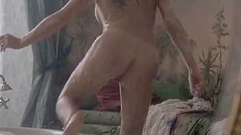 Leelee Sobieski shows a brief view of her cunt from behind and has a mild lesbian sex scene with Tara Fitzgerald from the mainstream movie In A Dark Place