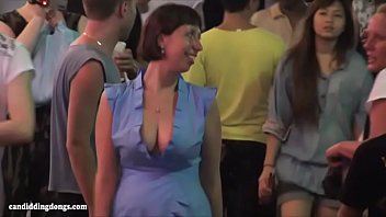 Busty Russian Milf walking down the street, candid bouncing boobs, cleavage