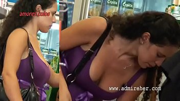Busty Spanish brunette walking down the street, candid bouncing boobs, slomo