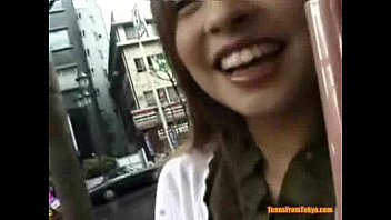 An Asian girl is walking down the street, being ques from http://alljapanese.net