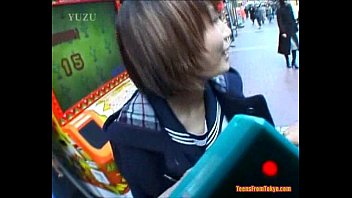 An Asian teen is walking along the streets accompani from http://alljapanese.net