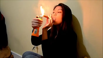 Asian Woman Smokes A Backwoodz